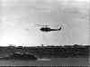 A Huey helicopter heading for home.