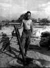 Salazar posing with a cleaned 81 mm. mortar.