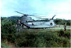 Guarding a Chinook while troops load up