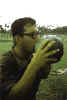 Salazar sucking water out of a coconut