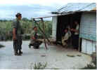 Garza and Platson at a villager's hut